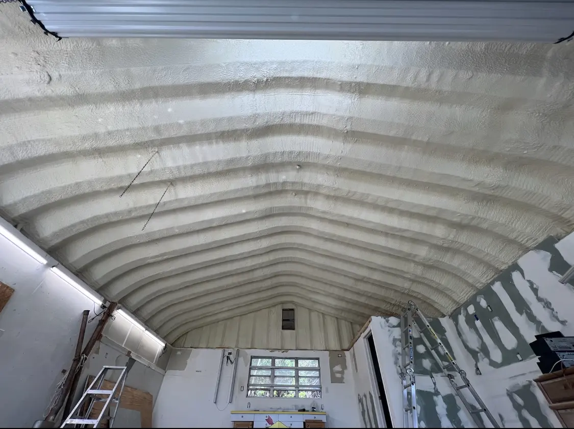 Spray polyurethane foam applied to the underside of a metal roof deck in Bon Air